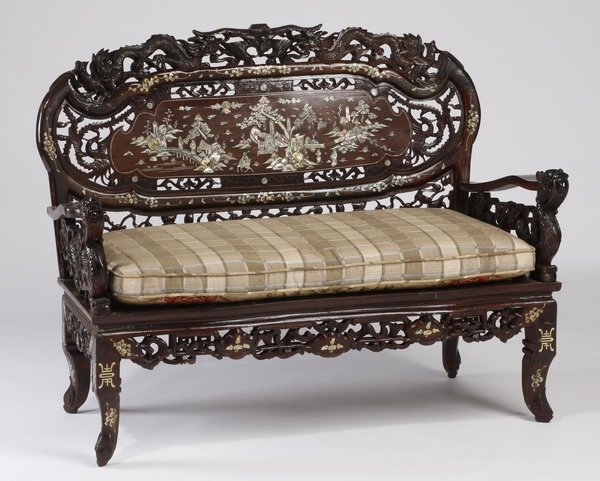Mother of pearl inlaid and carved settee: Pierce carved Asian settee, mid to late 20th century, the oval backrest with a dragon carved border encircling a central mother-of-pearl inlaid lunette with scenes of genre life, surmounting a loose c