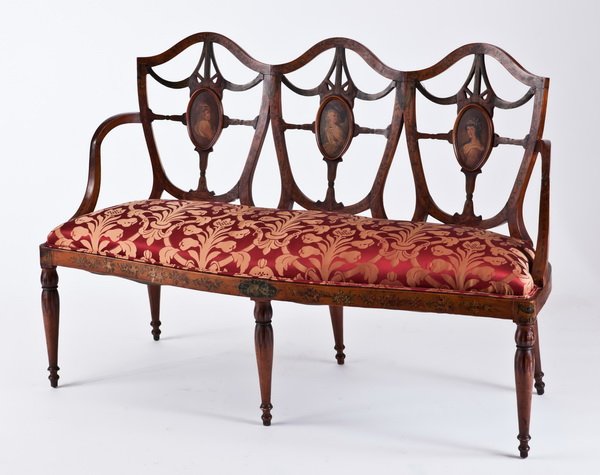 19th c. English Adams style settee: Early 19th century English Adams style decorated settee upholstered in red silk brocade, the shield form backrest with hand painted oval portraits, 37"h x 53"w x 23"d.
