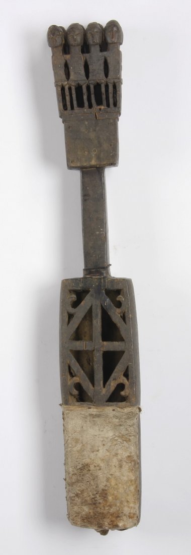 Sarangi musical instrument, Northern India: Sarangi musical instrument, Northern India, a type of chordophone used in Hindustani music, carved from a single block of tun (red cedar) wood, with eight pegs formed as figures surmounting the neck, 