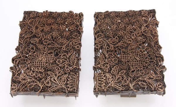 (2) Indonesian copper tjaps: Pair of early to mid 20th century Indonesian copper tjaps used in creating Batik fabrics, the opposing stamps with a central bird and ornate foliate and floriate ground, 8"h x 5.5"w x 3"d each.