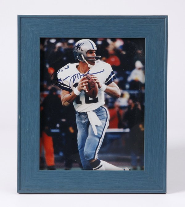 Roger Staubach autographed photo: Framed, autographed photo of Heisman Trophy winner and Dallas Cowboys' Super Bowl MVP Roger Staubach, signed Roger Staubach, 10"h x 8"w, overall size including frame 13"h x 11"w x 1"d.