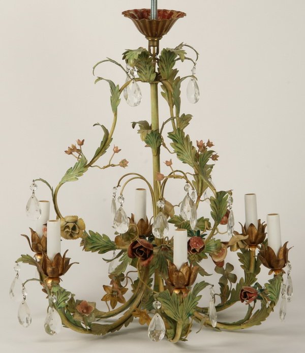 Tole chandelier with crystal prisms: 6-arm tole chandelier decorated with leaves and flowers and accented with hanging crystals, 24"h x 22"w.