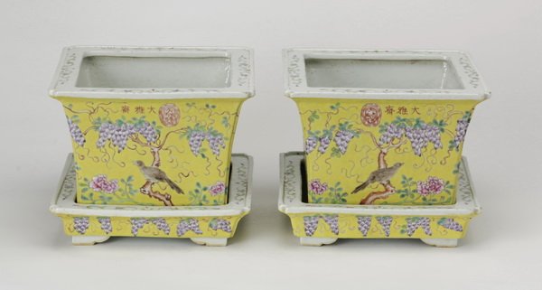 (2) Dayazai-style porcelain jardinieres: Pair of late 19th or early 20th century Dayazai style porcelain jardinières, each side having a bird perched amid trailing wisteria against a lemon ground, inscribed and with a seal mark along one si