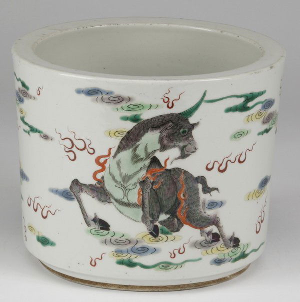 19th c. Chinese famille verte brush holder: Late 19th or early 20th century Chinese famille verte porcelain brush pot, the hand-painted decoration portraying supernatural creatures with flames rising from their bodies, including a goat, a qilin