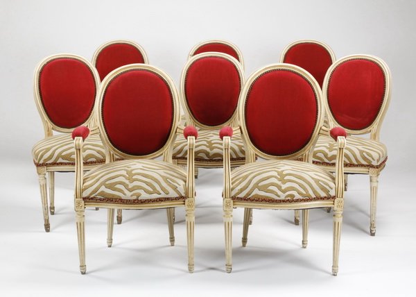(8) French chairs upholstered in zebra print: Set of 8 Louis XVI style chairs with balloon backs upholstered in raspberry-colored velvet with brass nailhead trim, the seats upholstered in beige and mustard zebra-print fabric and resting on fluted