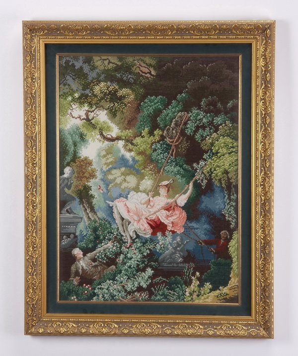 Hand knotted needlepoint tapestry: Framed and matted gross point and petit point tapestry depicting an 18th century genre scene, with a maiden swinging in the garden, in shades of green and pink, overall size including frame 32"h x 25.