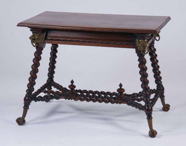 19th c. Victorian barley twist table: Late 19th century American Victorian barley twist table by Merklen Brothers, crafted of mahogany with cast brass mounts, the apron with rope molding and fully formed lion masks at the canted corners,