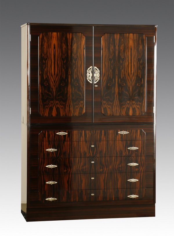 Mid 20th c. rosewood veneered chest: Mid 20th century wardrobe/linen press crafted of East Indian rosewood veneer, the upper portion with two doors opening to reveal interior storage and drawers, all over five long drawers, 69.5"h x 47"w