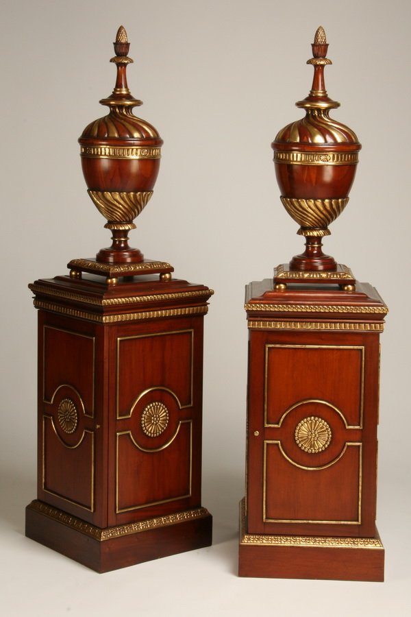 (2) Carved and parcel gilt urns on pedestals (1 of 2)