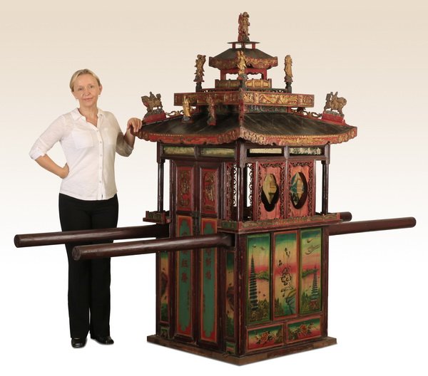 Chinese carved sedan chair: Chinese carved and decorated sedan chair, used to transport individuals of wealth and social position using four bearers; cabinet 88"h x 34.75" square, overall size including poles 88"h x 34.75"w x 10