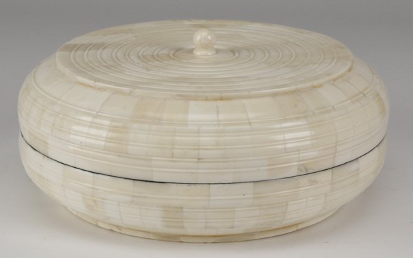Inlaid bone lidded container: Circular lidded container of inlaid bone, opening to a black lacquer interior, 3.5"h x 10" diameter.