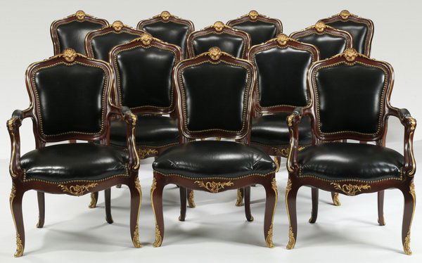 (12) Carved mahogany chairs in leather (1 of 3)
