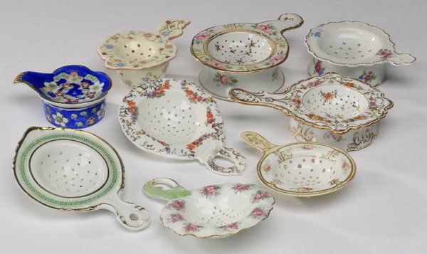 9-Piece group of porcelain tea strainers (1 of 4)