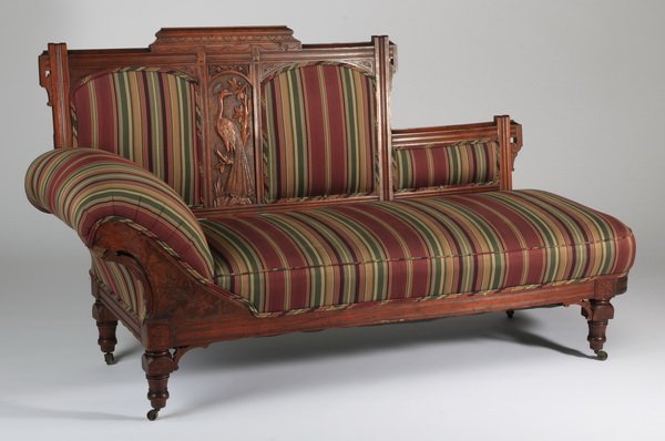 Early 20th c. chaise, 72"l: Late 19th or early 20th century American Renaissance Revival carved walnut chaise, the asymmetrical back with a peacock carved backsplat, surmounting a rectangular seat with one curved arm, all newly