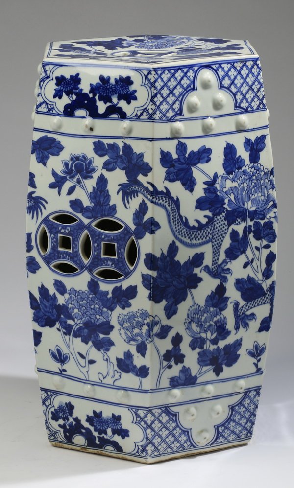 Chinese blue and white porcelain garden seat: Chinese blue and white porcelain garden seat with faceted sides, decorated overall in the pierced-coin motif, the central body depicting a dragon amidst peony blossoms, the neck and base with floral c