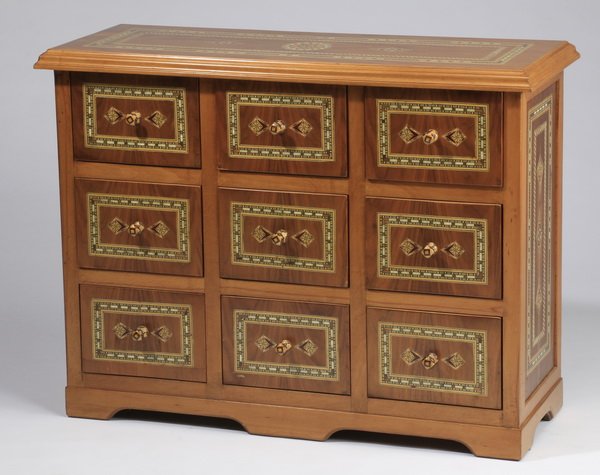 Syrian mother-of-pearl inlaid chest: Syrian mother-of-pearl inlaid chest of drawers, the rectangular top surmounting nine small drawers, and raised on bracket feet, 31.25"h x 40.5"w x 16"d.