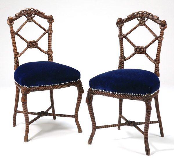 (2) French carved 'rope' chairs, 34"h: Pair of French carved walnut 'rope' occasional chairs, having arched crests in the form of intricately tied knots continuing to the pierced back splats centering sailor's knots above the blue velvet u