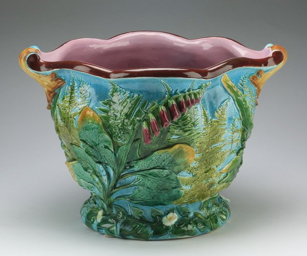 Majolica jardiniere attrib. to Minton, 19th c: Continental majolica jardinire attributed to Minton, late 19th or early 20th century, having a scalloped rim with scrolled acanthus handles above a conforming body with relief ferns and foxglove decor