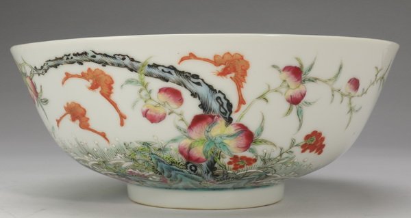 Finely potted porcelain bowl, Guangxu mark: Finely potted Chinese porcelain bowl, enamel decorated with clusters of ripe peaches in rockery, and auspicious fu bats overhead, the underside with an iron-red six-character Guangxu mark, 3"h x 7.5" 