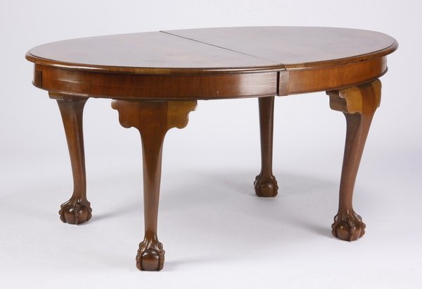 Italian burl wood dining table: Mid 20th century oval Italian burl wood dining table with one center leaf, all raised on cabriole legs terminating in ball and claw feet, 28.75"h x 84"l x 40.5"w with leaf, 60"l without the center lea