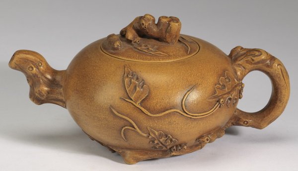 Chinese zisha peanut and jujube teapot, 4"h: Chinese zisha teapot, having a figural peanut and jujube finial above a compressed yellow body decorated with high relief peanuts, jujubes, vines, and tendrils near the branch form handle, the undersi