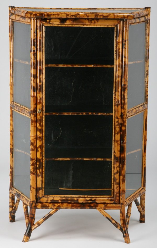 Early 20th c. English bamboo curio cabinet: Fine early 20th century English bamboo curio cabinet with canted sides and applied decorations, 45.5"h x 33"w x 15"d.