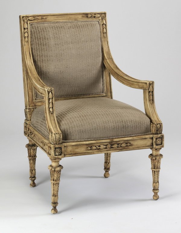 Gustavian style upholstered armchair, 19th c.: Gustavian style armchair, late 19th century, the seat back carved with bellflower motifs on the corners leading to armrests terminating in acanthus blooms, the seat rail carved with similar bell flowe