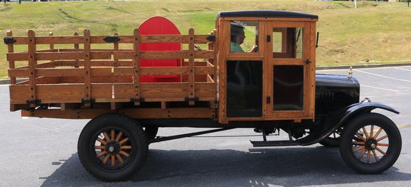 1926 fully restored Ford model TT truck: 1926 Ford model TT one-ton truck, fully restored, having a closed oak cab and oak stake body, with nickel plated headlight rims, vented cowl, a model T Ford Moto-Meter radiator cap/gauge with Boyce wr