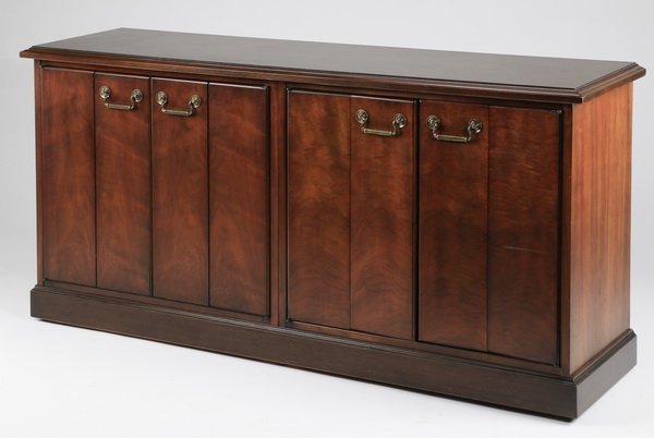 Mahogany credenza, 60"long: Mahogany credenza having two pairs of bi-fold doors with brass pulls opening to two shelves, 30.25"h x 60"l x 19.25"d
