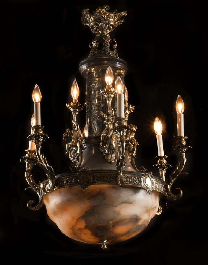 19th c. bronze, marble and alabaster chandelier, 38"h: Late 19th or early 20th century Empire style patinated bronze chandelier with marble supports, the central columns surrounded by a trio of cherubs each holding a light aloft, leading to an alabaster d