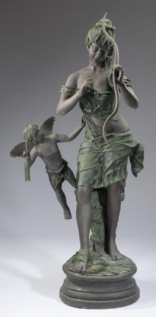 Bronze sculpture of Venus disarming Cupid, 66"h: Patinated bronze sculpture of Venus disarming Cupid, the draped figure of Venus playfully holding Cupid's bow aloft as Cupid looks on mid-air while holding his arrow, 66"h x 29"w x 19.5" diameter of b