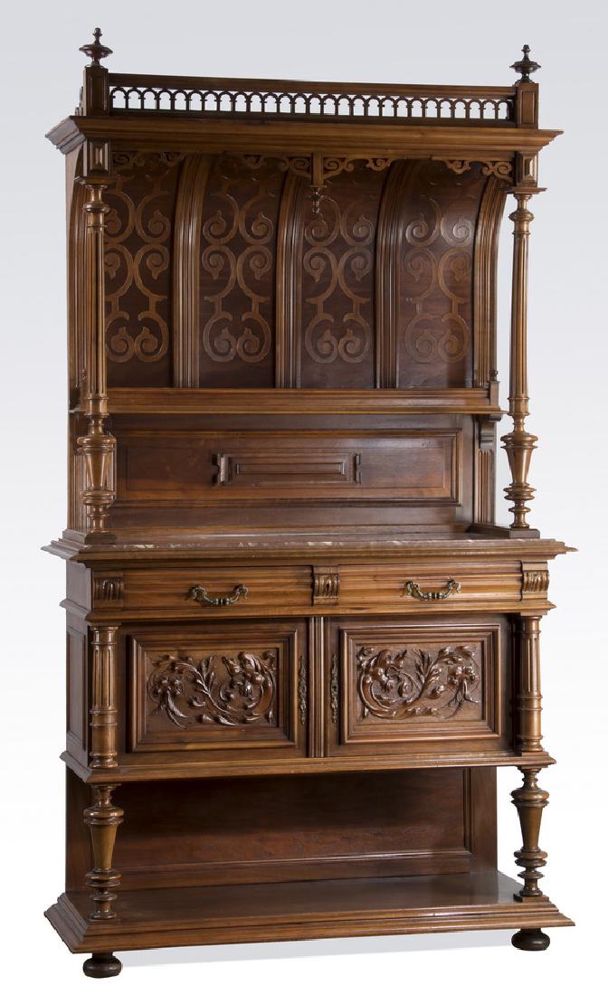 19th c. French carved walnut buffet, 88"h: French walnut buffet, 19th century, having a pierced arched gallery flanked by finials, surmounting a stepped pediment over a curved backsplash with wood applique designs and plate shelf, supported by