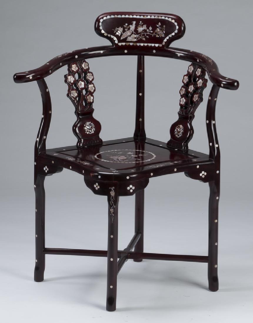 Chinese rosewood and mother-of-pearl corner chair: Chinese rosewood corner chair with mother-of-pearl inlay, having stylized vases with prunus blossoms as the backrest, the whole resting on straight legs joined by an X-stretcher, 33.5"h x 28"w x 22"d,