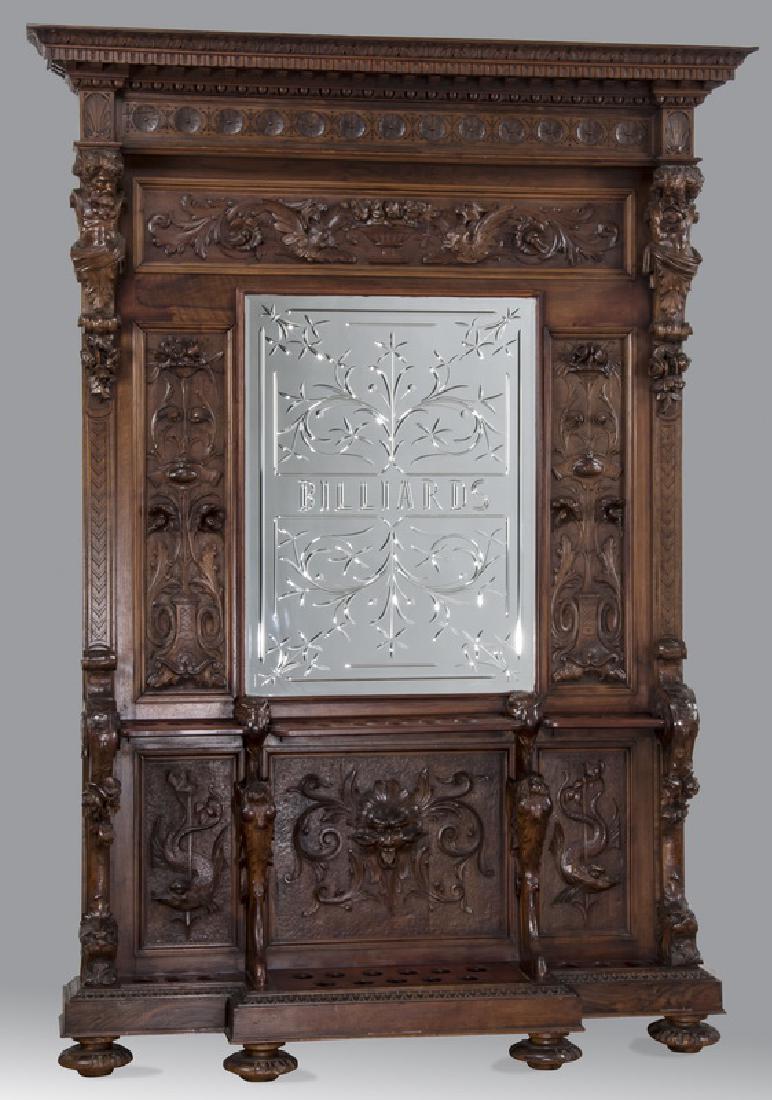 19th c. carved walnut cue rack w/ 'Billiards' mirror: 19th century Italian Renaissance Revival carved black walnut cue rack with central Venetian wheel cut mirror engraved "Billiards" framed by relief carved foliate panels flanked by opposing male term f