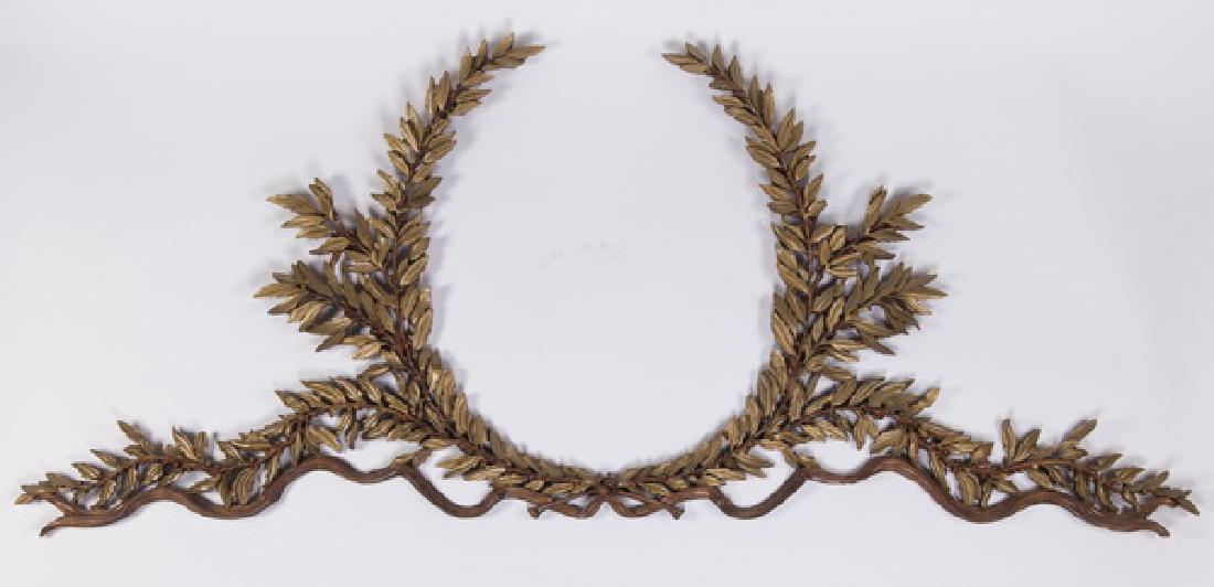 Continental gilt wood laurel wreath, 96" long: Continental Louis XVI style carved gilt wood architectural element in the form of a laurel wreath with ribbons and garland, 42.5"h x 96"l.