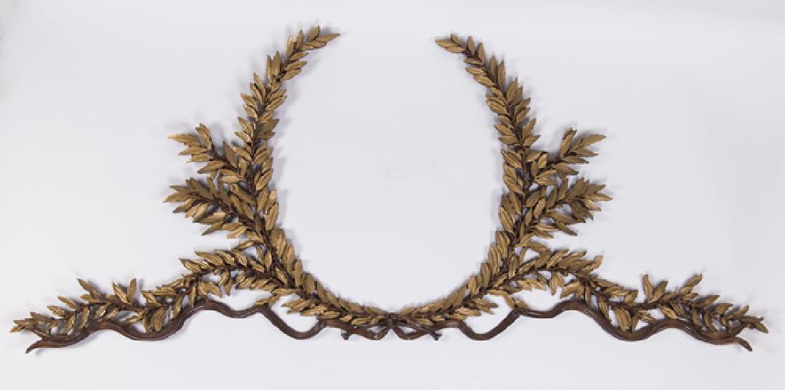 Continental gilt wood laurel wreath, 96" long: Continental Louis XVI style carved gilt wood architectural element in the form of a laurel wreath with ribbons and garland, 42.5"h x 96"l.