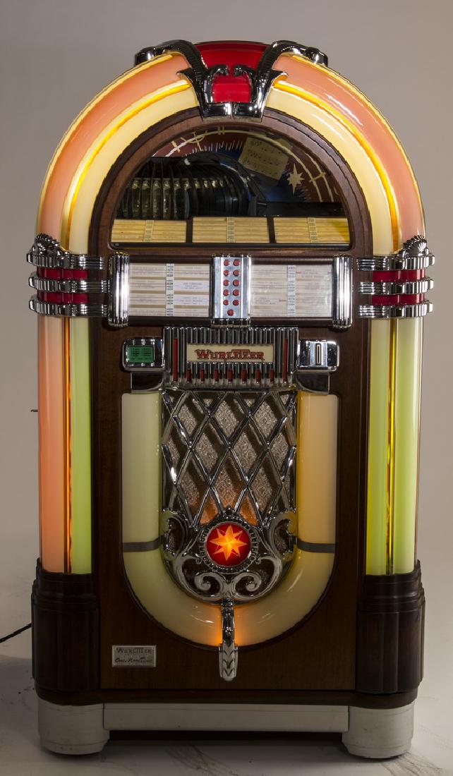 Wurlitzer 'One More Time 1015' jukebox, 60"h: Wurlitzer 'One More Time 1015' vinyl Bubbler jukebox, this replica of the famous 1946 'Bubbler' having an arched top with bands of glowing lights, rotating light columns, and bubbles with chrome accen