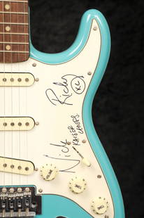 Kaiser Chiefs: a guitar autographed by Ricky Wilson: and Nick Baines, a Stratocaster style guitar with lake placid blue finish, signed on the scratchplate by Ricky Wilson and Nick Baines in black marker Height: 100cm