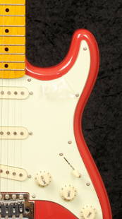 Chris Rea: a guitar autographed by Chris Rea: Chris Rea: a guitar autographed by Chris Rea, a Stratocaster guitar with Fiesta Red finish, signed on the body by Chris in black marker and dated 27.4.06, in soft case Height: 100cm