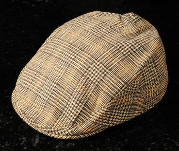 Elton John: flat cap, 1970s: Elton John: previously personally owned and worn flat cap, traditional style tweed flat cap, label sewn into hat 'Property of Madam Tussauds, bearing the name Elton John stating date 70s and origin