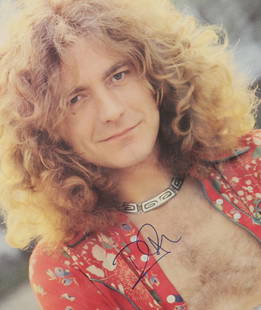 Led Zeppelin / Robert Plant: signed poster: colour poster of a young Robert Plant signed in blue fountain pen to centre, framed Dimensions: 90.5cm x 61cm
