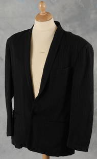 Eric Clapton owned jacket: Eric Clapton jacket worn on stage during the 1980s A black light weight jacket with repeating pattern of a female head throughout, J. Francois Charles Piero Panchetti Made In Italy label, worn on