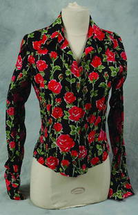Sheryl Crow worn concert shirt: *Sheryl Crow shirt worn in ABC In Concert, 1997 A tight fitting, black long-sleeved shirt with red and green floral pattern labelled Pamela Barish, worn by Sheryl Crow. Please note this lot is