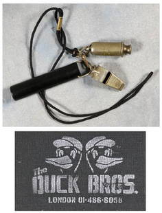 Duck Whistles owned and worn by Eric Clapton: A set of 'Duck Brothers' duck whistles owned by Eric Clapton Three whistles - one marked The Acme Siren the other The Acme Thunderer and one other, on a black cord strap as worn on stage by