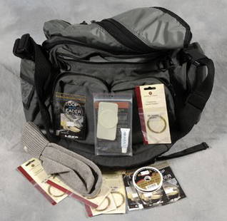 Eric Clapton's fishing bag: Eric Clapton's fishing bag A khaki and black canvas fishing bag manufactured by Abel together with a letter from Brookemead Veterinary Surgery, dated 25th June 2003, confirming it was one of