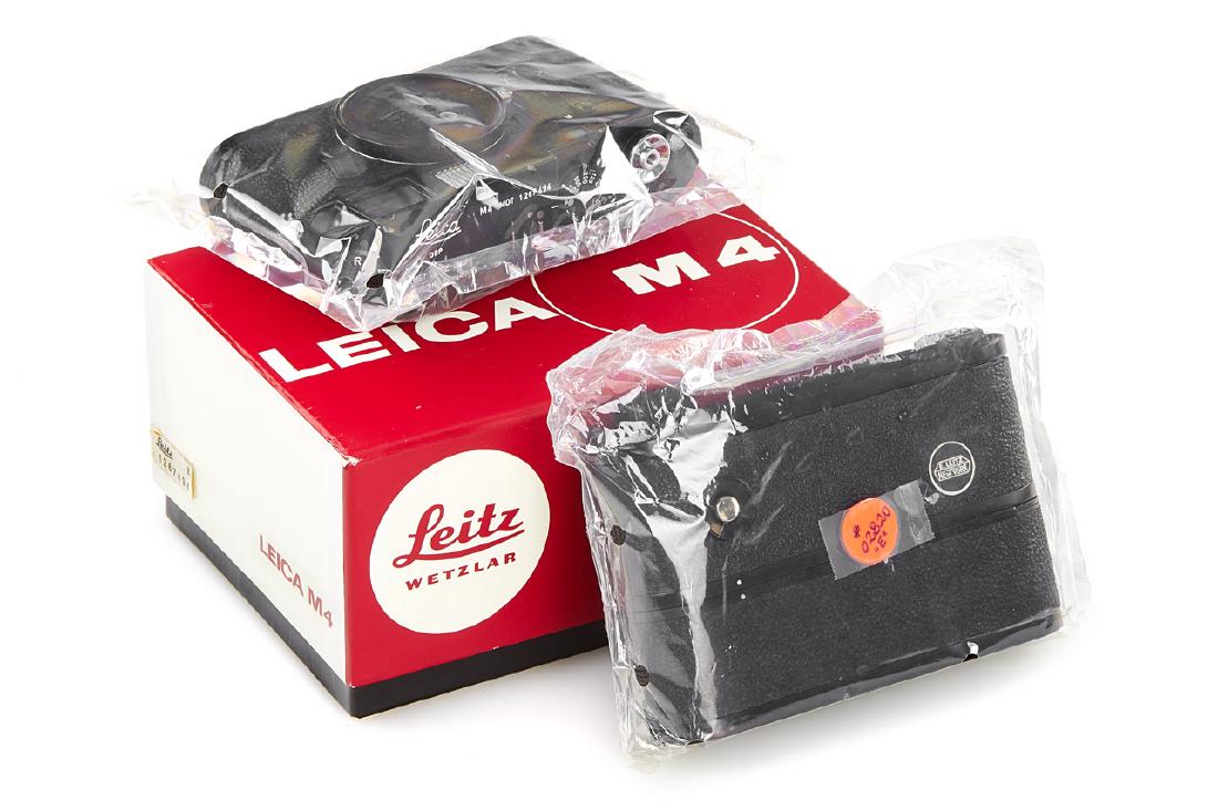 Leica M4 MOT black paint + NY Motor Drive *, 1970, no.: never used absolutely new sealed body with body cap, papers, registry card and maker's box with matching serial number with also new and sealed NY Motor Drive no.2820 'E' with instructions- ex Jim Jan