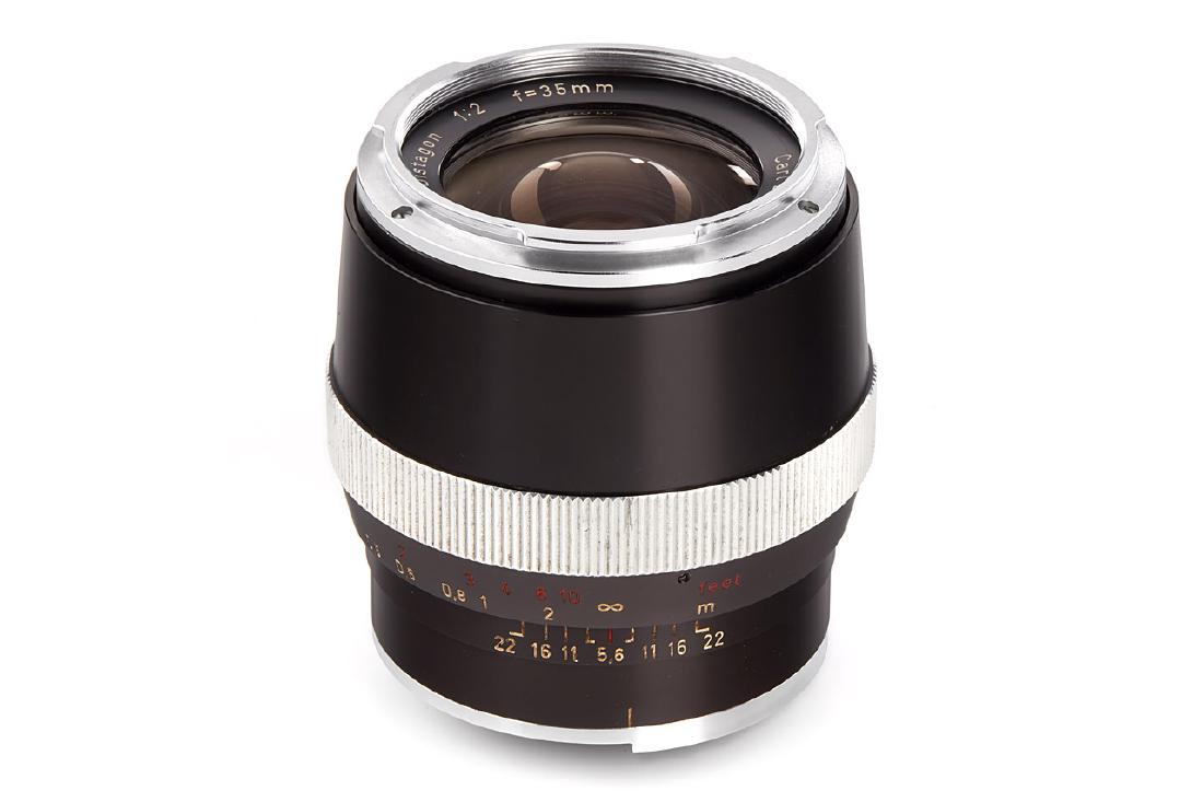 Carl Zeiss 2/35mm Distagon black *, 1965, no. 3693149: for Contarex, in excellent condition, slightly hazy and some cleaning marks, with front cap and matching plastic keeper The buyers premium for all items exported out of E.C. (European Community) is 25