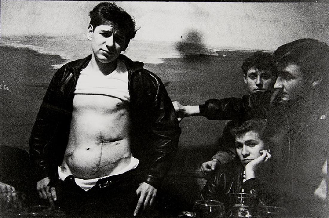 WILL MCBRIDE (1931-2015): 'Cowboy Code', Munich 1961 Gelatin silver print, 1980s, 21,8 x 32,8 cm Signed, annotated and dated by the photographer in pencil on the reverse The buyers premium for all items exported out of E.C. (E