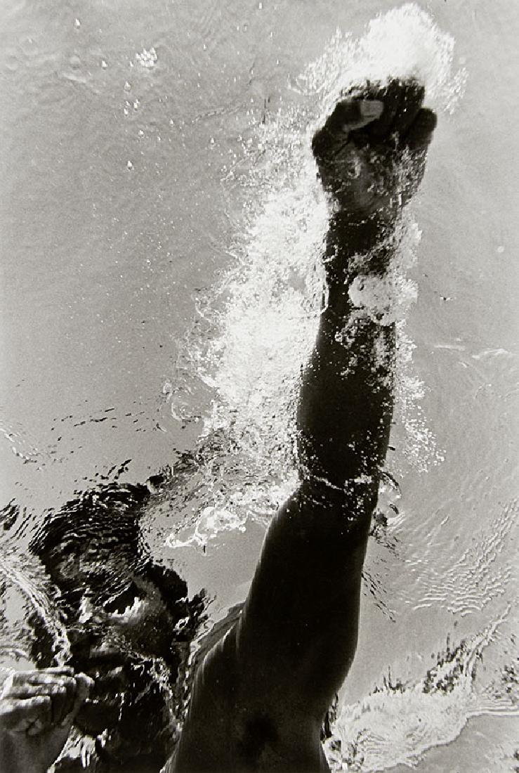 FLIP SCHULKE (1930-2008): Muhammad Ali boxing underwater, Miami 1961 Gelatin silver print, 1990s, 31,7 x 21,3 cm Signed by the photographer in pencil on the reverse, his copyright studio label also on the reverse The buyers pr