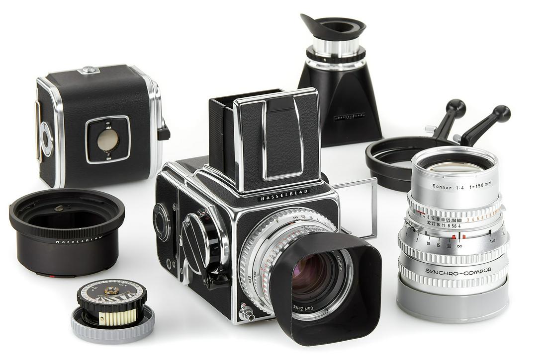 Hasselblad 500 C/M outfit: Body In Beautiful Condition And In Good Working Order, With Chrome Planar 2.8/80Mm No.4290691 (Front Cap), Chrome Sonnar 4/150Mm No.4588038 (Caps), A12 Magazine No.Tu108256, Second A12 Magazine No.Tr1